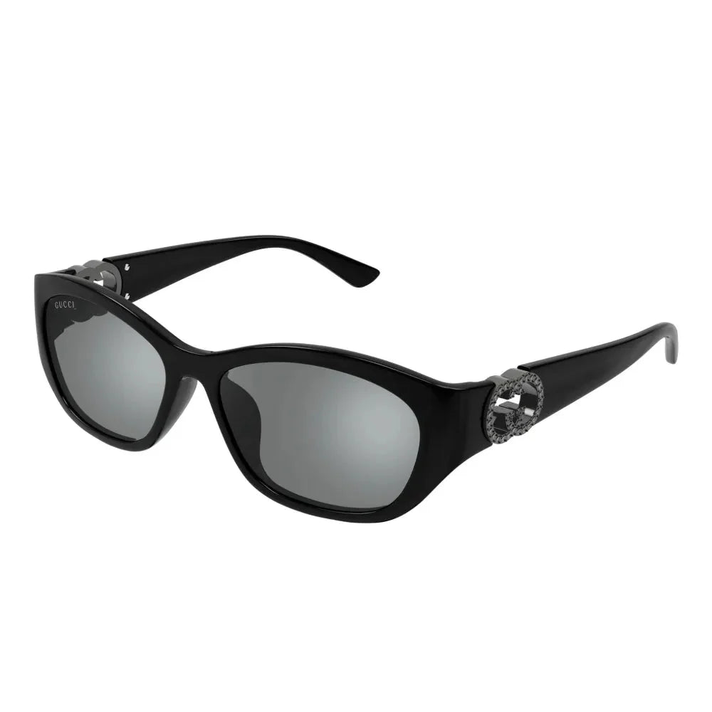 Black Gucci luxury sunglasses for women with oversized oval lenses and crystal-embellished temples