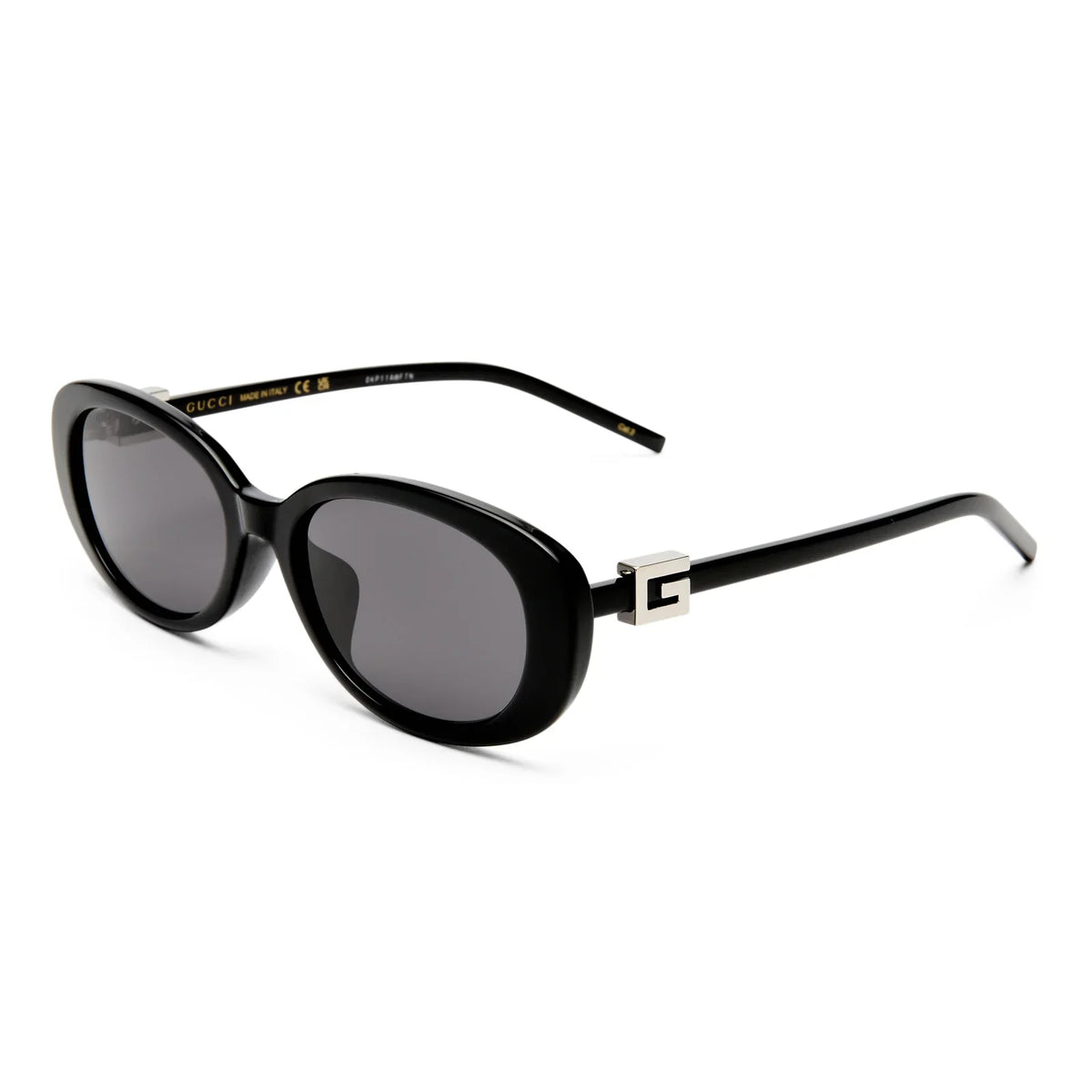 Black oversized oval sunglasses with silver logo detail on the temples.