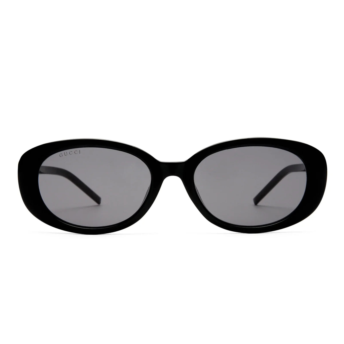 Gucci black oval sunglasses with dark tinted lenses and slim frames