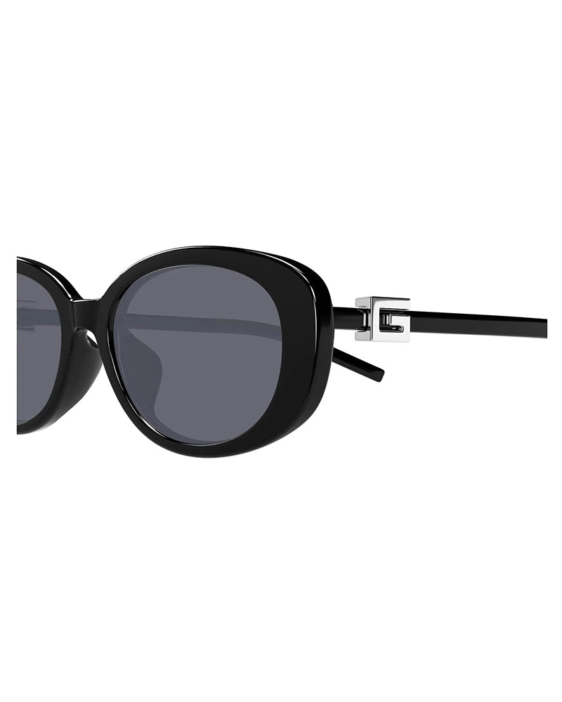 Large black oversized round frame sunglasses with dark tinted lenses.