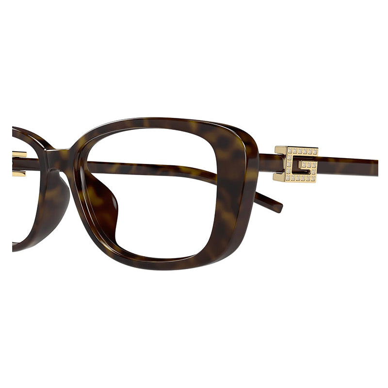 Tortoise shell luxury eyewear with gold-tone hardware and crystal-embellished temples.