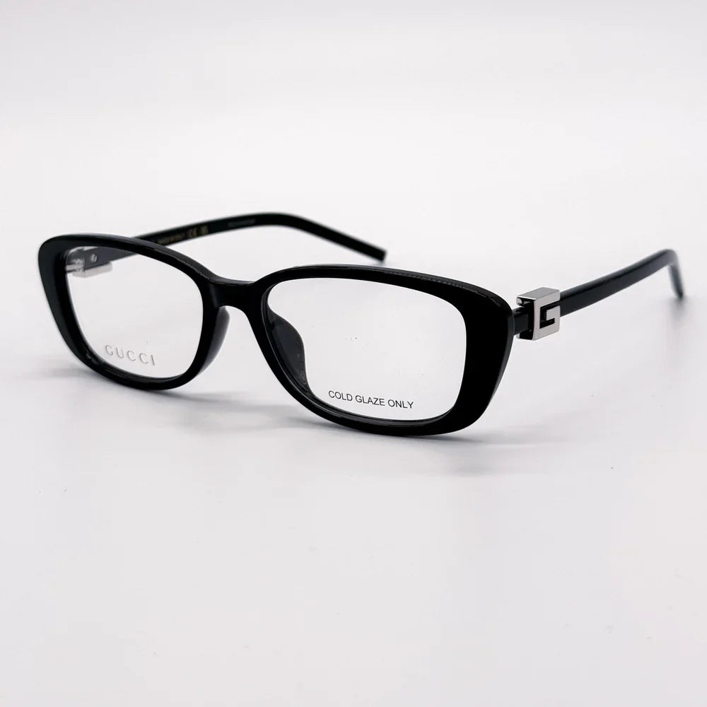 Black Gucci rectangular eyeglasses with clear lenses and silver temple accents.