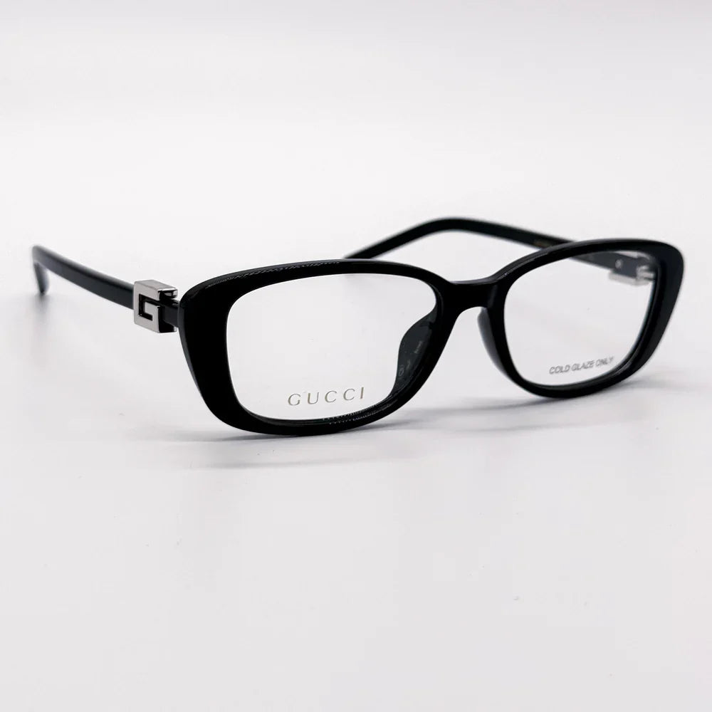 Black Gucci luxury eyeglasses with rectangular frames and clear lenses.