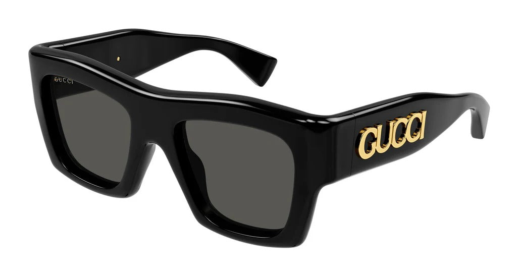 Black Gucci luxury oversized sunglasses with gold logo on temples